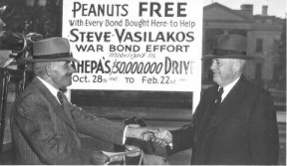 Ahepa drive for War Bond sales, Steve Vasilakos, beside his peanut cart